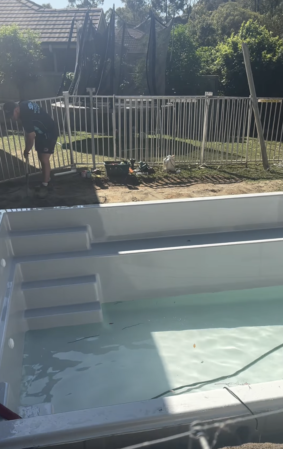 A WHO Pools crew member working on a fresh pool install